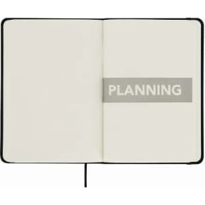 A blank notebook with a black cover, featuring two open pages. One page has the word "PLANNING" highlighted.