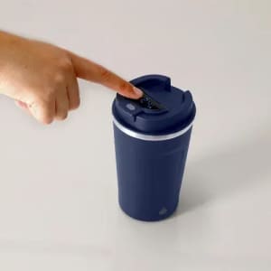 A drink bottle in navy blue with a push-button lid and a white band around the middle, featuring a logo.