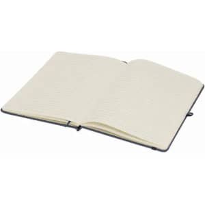 An open notebook with blank cream pages and a navy blue cover, featuring a logo on the front.