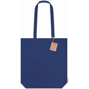A tote bag in navy blue with long handles and a rectangular shape, featuring a tag.