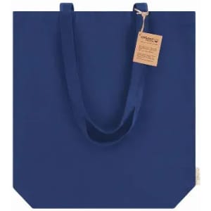 A navy blue tote bag with long straps and a tag attached, featuring a simple, solid design.