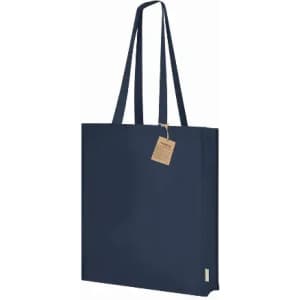 A navy blue tote bag with long handles and a tag attached. It features a simple, minimalist design.