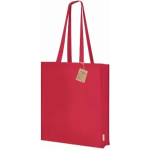 A red tote bag with long handles and a small tag attached. It has a simple, minimalistic design.
