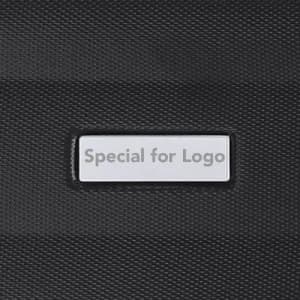 A black drink bottle featuring a textured surface and a rectangular area for branding or a logo.