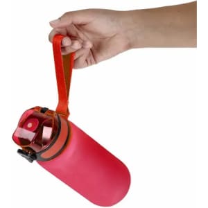 A drink bottle in vibrant pink with an orange strap and a black lid, featuring a brand logo.