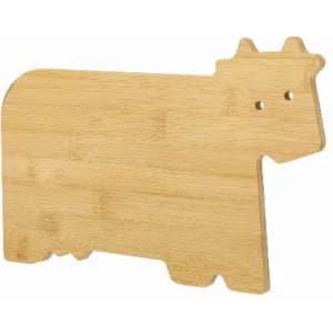 A bamboo cutting board shaped like a cow, featuring a natural wood finish and rounded edges.