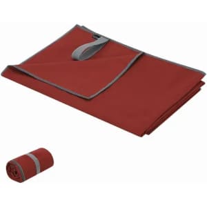 A red camping mat with grey trim, folded and rolled for storage. It features a strap for easy carrying.