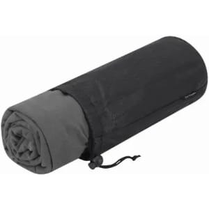 A rolled camping mat in grey and black, secured with a drawstring. It has a textured surface and a compact design.