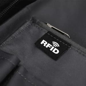 A close-up of a black fabric pocket featuring an RFID tag label. The material appears durable and textured.