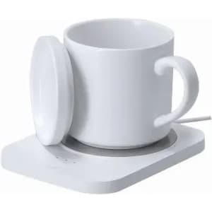A white thermal mug with a lid placed on a matching white warming base.