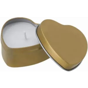 A heart-shaped candle in a gold tin container, featuring a white wax interior and a central wick.