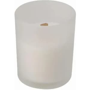 A white candle in a frosted glass holder, featuring a wooden wick.