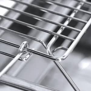 A stainless steel grill rack showing metal bars in a close-up view with intricate detailing.