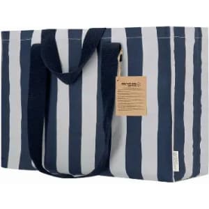 A tote bag with a navy blue and white striped design, featuring sturdy handles and a label.