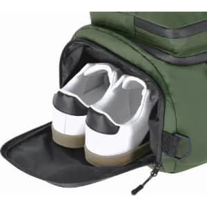 A green bag with a shoe compartment featuring a pair of white sneakers with black accents inside.
