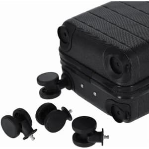 A black suitcase with four removable wheels placed beside it. The suitcase has a textured surface and visible connectors.
