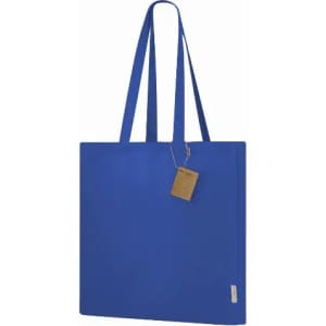 A blue tote bag with long handles and a tag, featuring a simple and modern design.