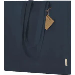 A navy blue tote bag with two handles and a tag attached, featuring a minimalistic design.