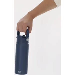 A drink bottle in navy blue with a handle, being held by a hand. The bottle features a logo.