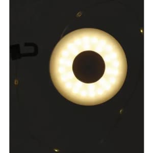 A circular LED light with a white glowing halo and a hook attachment, set against a dark background.