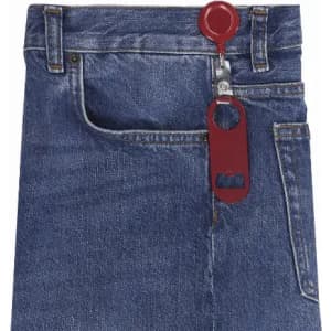A pair of blue denim jeans featuring a red zipper pull with a built-in bottle opener.