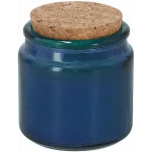 A dark blue glass jar with a cork lid, featuring a smooth, shiny finish.