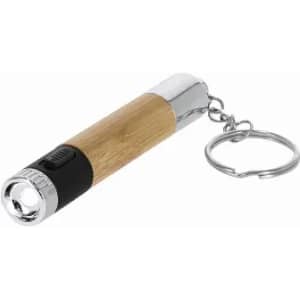 A keychain flashlight with a wooden grip and chrome accents, featuring a push button and a keyring attachment.