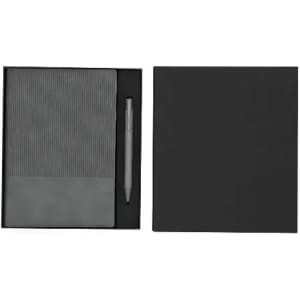 A gift set featuring a grey notebook with a ribbed design and a matching pen, all in a black box.