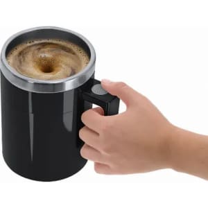 A drink bottle in black with a stainless steel rim, featuring a handle, containing coffee with froth on top.