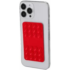 A smartphone with a clear case and a red silicone brick attachment on the back.