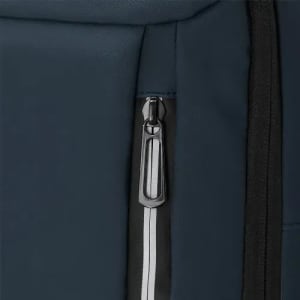 A close-up of a blue fabric surface with a silver zip and black trim. The image highlights the zipper's detail.