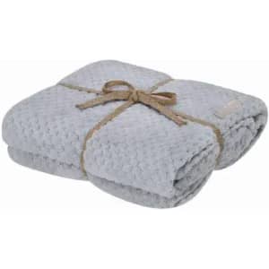 A soft grey blanket neatly folded and tied with a jute string. It has a textured surface and a simple design.