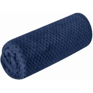A rolled navy blue blanket with a textured fabric, featuring a soft, plush appearance. It has a cylindrical shape.