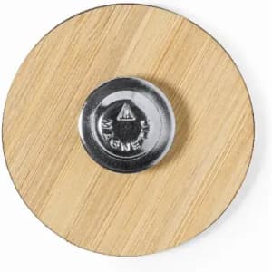 A round bamboo magnet with a shiny metallic centre, showcasing a minimalist design.