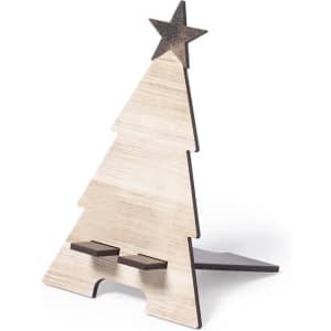 A wooden Christmas tree stand with a star on top, featuring a natural finish and contrasting darker accents.