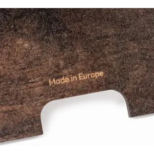 A wooden surface with a smooth finish and a subtle engraving stating "Made in Europe."