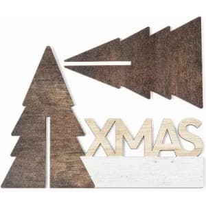 Wooden decorative piece featuring trees and the word "XMAS" in a rustic finish with brown and white colours.