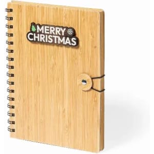 A notebook with a bamboo cover, featuring a spiral binding and a festive "Merry Christmas" design on the front.