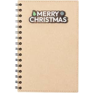 A kraft notebook with a spiral binding and a "Merry Christmas" design at the top. It features a plain cover.