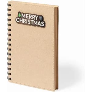 A spiral-bound notebook in a kraft finish, featuring a decorative "Merry Christmas" design on the cover.