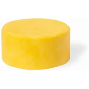 A round, yellow cheese wheel sits against a white background.