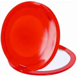 A red compact mirror with a shiny exterior and a reflective interior. It has a circular shape and a hinged opening.