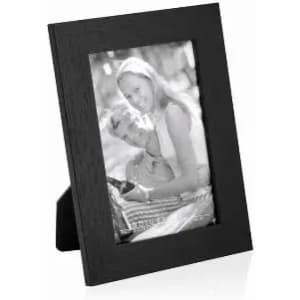 A black photo frame displaying a black-and-white image of a couple. The frame is designed for tabletop display.