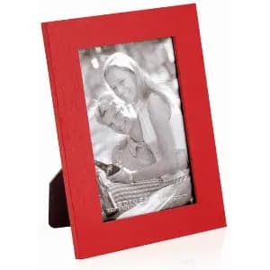 A red photo frame displaying a black and white image of a couple. The frame is upright and has a stand at the back.