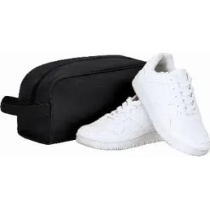 A black toiletry bag next to a pair of white sneakers with a textured design on the side.