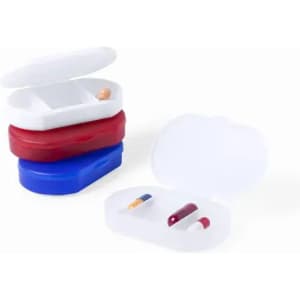 A stack of three pill containers in red, blue, and white, with one container open showing pills inside.