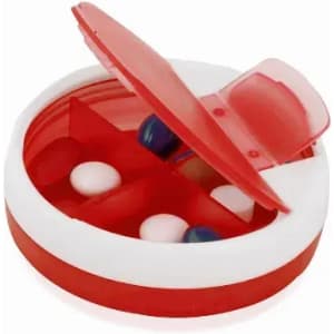 A pill organiser with a red and white design, featuring compartments for multiple tablets. The lid is partially open.