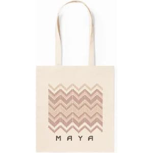 A tote bag in cream with a patterned design in reddish-brown and the word "MAYA" at the bottom.