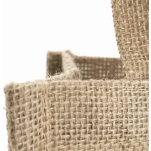 A natural jute bag featuring a woven texture and sturdy handles. The colour is light brown with a rustic finish.