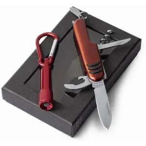 A multi-tool with a silver blade and red handle, accompanied by a red carabiner, in a black box.